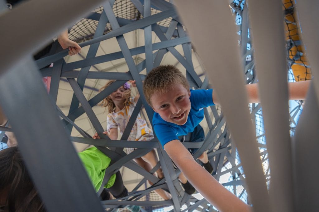 Climbing at CampMirage86 kid climbing at camp mirage